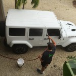 My awesome husband giving my Jeep a bath for me. 